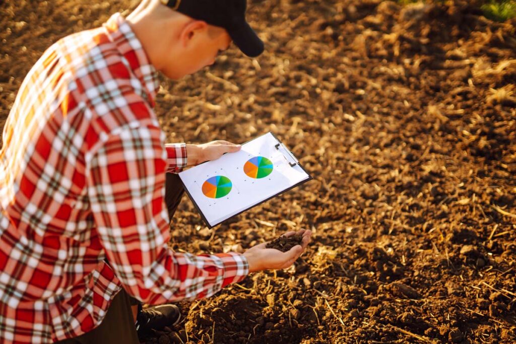 Hand Of Expert Farmer Collect Soil And Checking Soil Health Before Growth A Seed Of Vegetable.